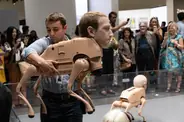 Jeremiah carrying a Regular Animals robot dog at Art Basel Miami Beach