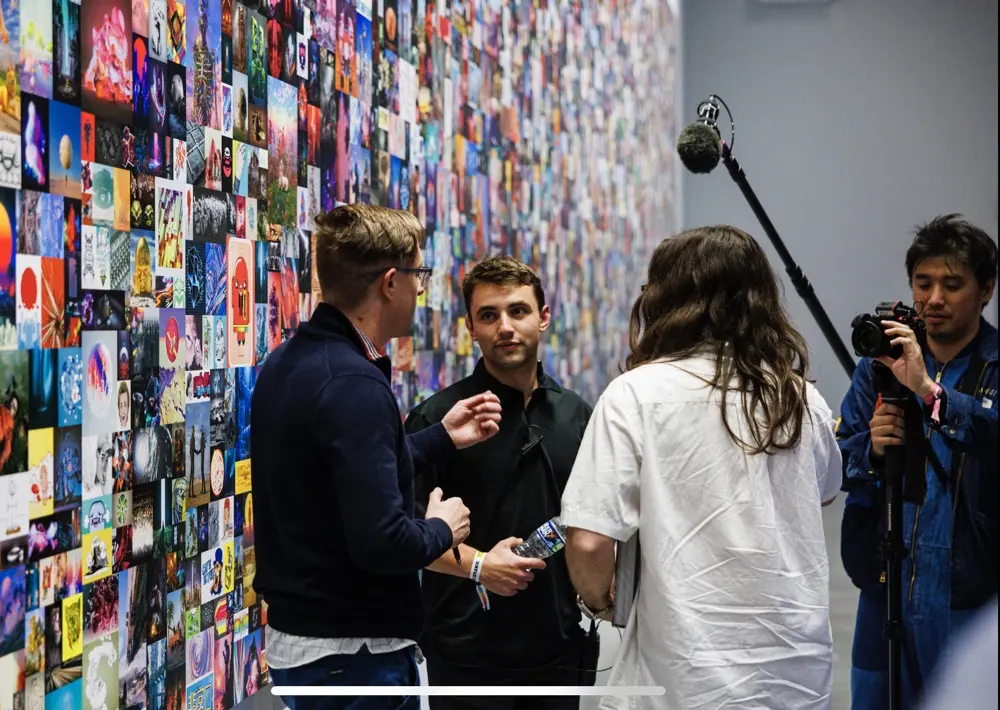Jeremiah with Beeple and Farokh during a filmed studio event