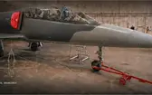 Grey L-39C Albatros jet in a hangar, overlaid with a general-arrangement schematic